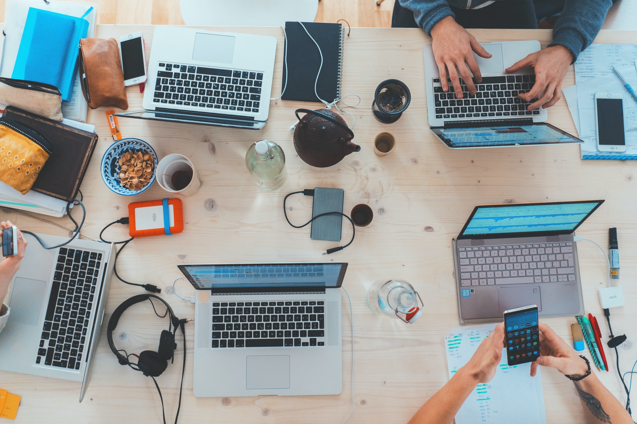 Overhead view of a team's workspace — every desk and task visible at once