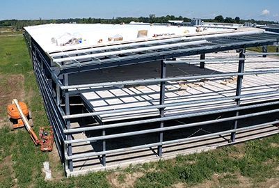 Concrete exterior steel building