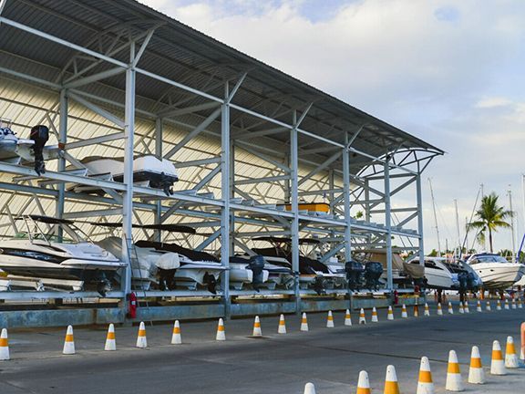 Boats of all kinds safely stored in metal buildings over wintertime